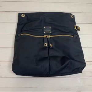 Black Henri Bendel bag with bold purple interior... no strap